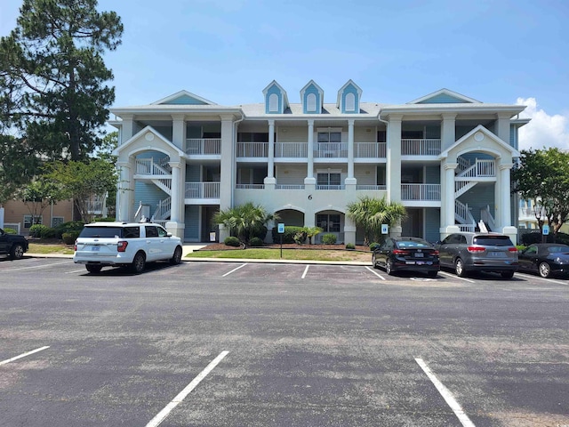 330 S Middleton Dr Unit 603, Calabash, NC 28467 - view of building exterior featuring uncovered parking