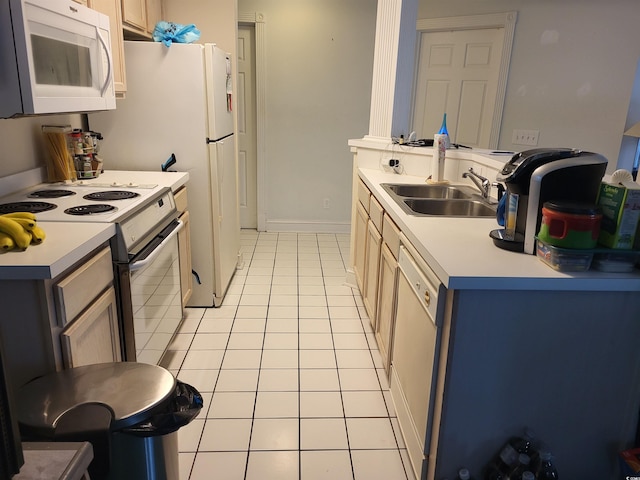 330 S Middleton Dr Unit 603, Calabash, NC 28467 - kitchen with white appliances, light tile patterned flooring, a sink, and light countertops