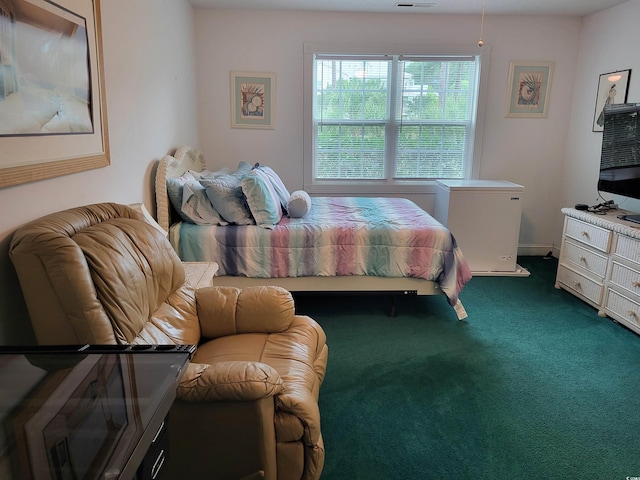 330 S Middleton Dr Unit 603, Calabash, NC 28467 - bedroom with dark colored carpet and fridge