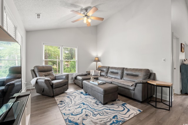 1936 Lees Landing Cir, Conway, SC 29526 - living area featuring lofted ceiling, a ceiling fan, wood finished floors, and a textured ceiling