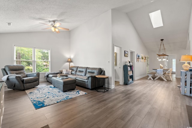 1936 Lees Landing Cir, Conway, SC 29526 - living area with a skylight, ceiling fan, plenty of natural light, wood finished floors, and high vaulted ceiling