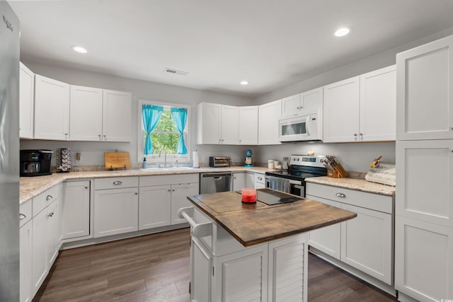 1936 Lees Landing Cir, Conway, SC 29526 - kitchen featuring stainless steel appliances, white cabinets, dark wood finished floors, and recessed lighting