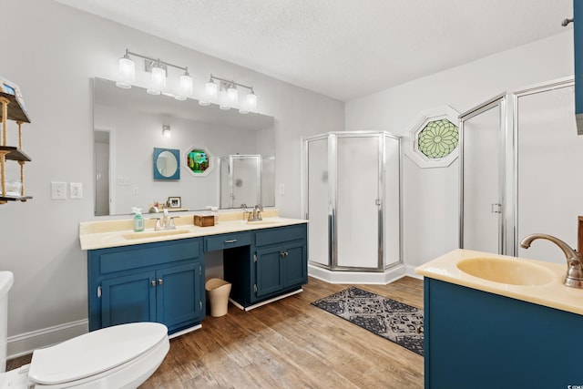 1936 Lees Landing Cir, Conway, SC 29526 - full bathroom with double vanity, a shower stall, wood finished floors, and a textured ceiling