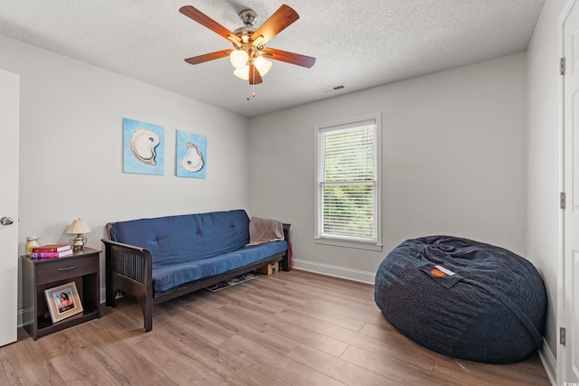 1936 Lees Landing Cir, Conway, SC 29526 - sitting room with wood finished floors, ceiling fan, and a textured ceiling