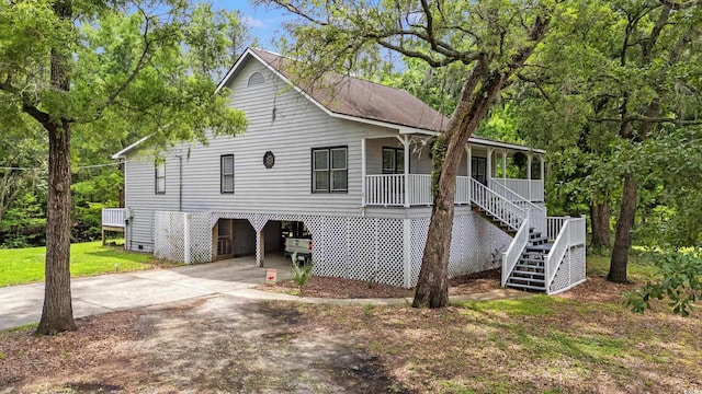 1936 Lees Landing Cir, Conway, SC 29526 - view of front of property with a carport, stairway, covered porch, and concrete driveway