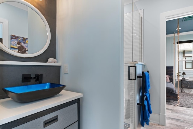 4900 N Ocean Blvd, Myrtle Beach, SC 29577 - full bath with wood finished floors, vanity, a stall shower, and ensuite bathroom