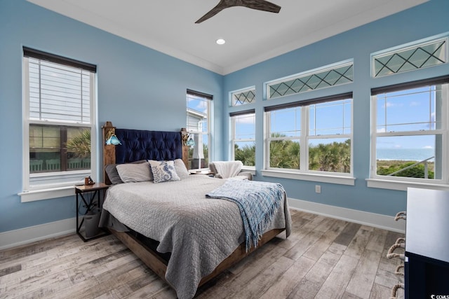 4900 N Ocean Blvd, Myrtle Beach, SC 29577 - bedroom with multiple windows, wood finished floors, baseboards, and recessed lighting