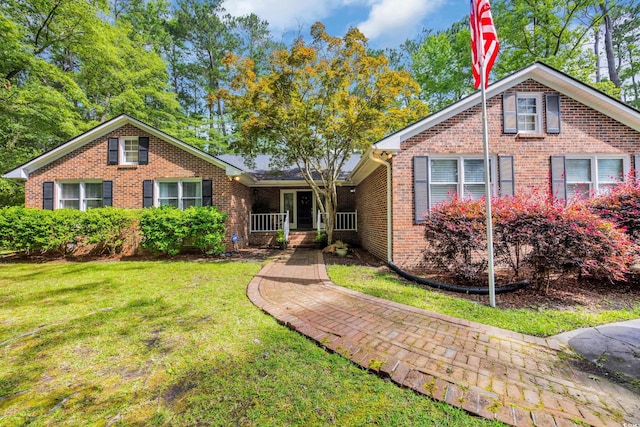 196 John Waites Ct, Georgetown, SC 29440 - single story home featuring brick siding, a front yard, and covered porch
