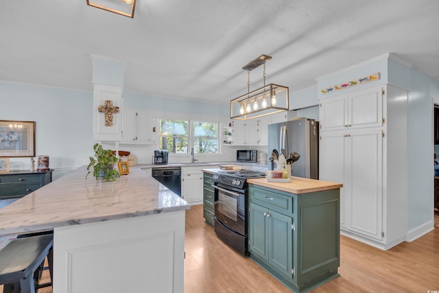 196 John Waites Ct, Georgetown, SC 29440 - kitchen with black appliances, white cabinetry, a peninsula, light wood-type flooring, and butcher block counters
