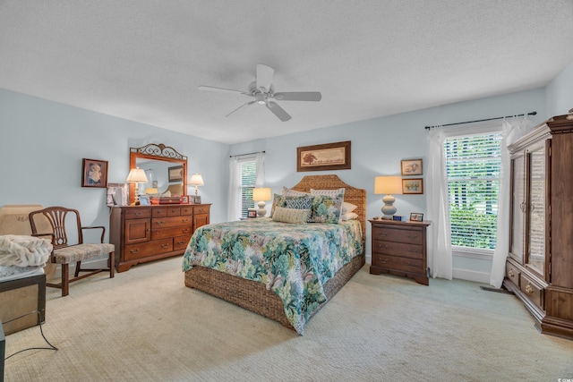 196 John Waites Ct, Georgetown, SC 29440 - carpeted bedroom with multiple windows, a textured ceiling, and ceiling fan