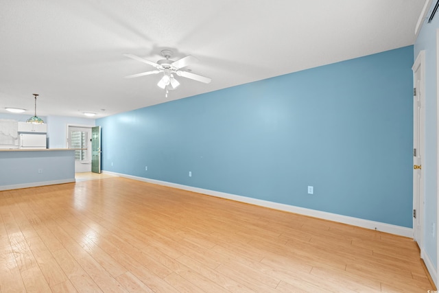 6016 Dick Pond Rd Unit 109, Myrtle Beach, SC 29588 - unfurnished living room featuring a ceiling fan, light wood-type flooring, and baseboards