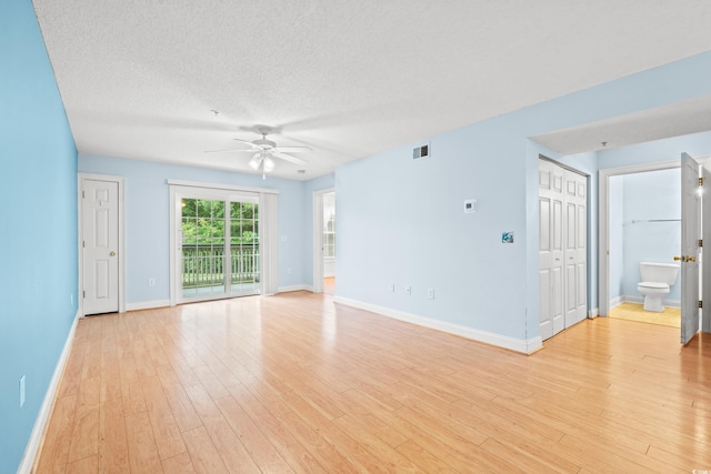 6016 Dick Pond Rd Unit 109, Myrtle Beach, SC 29588 - empty room with a ceiling fan, baseboards, light wood-type flooring, and a textured ceiling