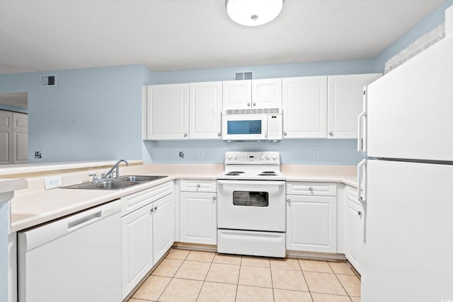 6016 Dick Pond Rd Unit 109, Myrtle Beach, SC 29588 - kitchen with white appliances, white cabinets, a sink, light tile patterned flooring, and a textured ceiling
