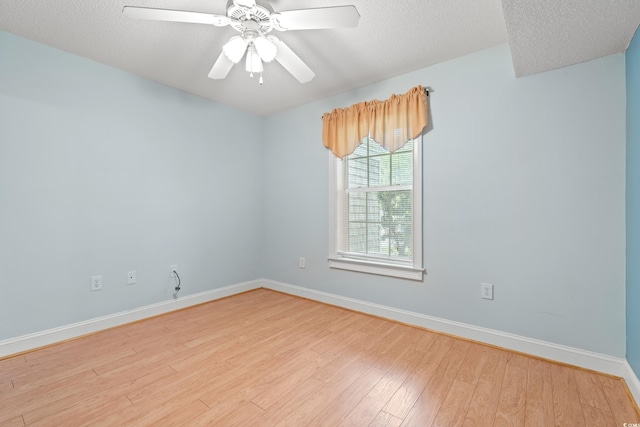 6016 Dick Pond Rd Unit 109, Myrtle Beach, SC 29588 - empty room featuring wood finished floors, baseboards, ceiling fan, and a textured ceiling