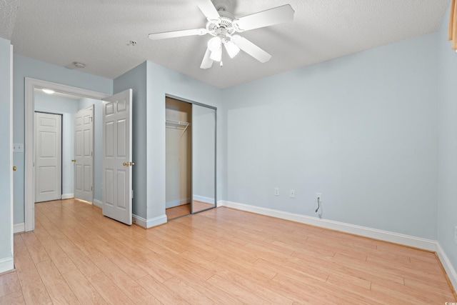 6016 Dick Pond Rd Unit 109, Myrtle Beach, SC 29588 - unfurnished bedroom with light wood finished floors, a closet, baseboards, a textured ceiling, and ceiling fan