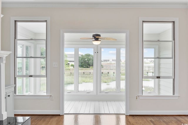 465 Vereen Rd Unit 10, Murrells Inlet, SC 29576 - doorway to outside with ornamental molding, a ceiling fan, wood finished floors, and baseboards