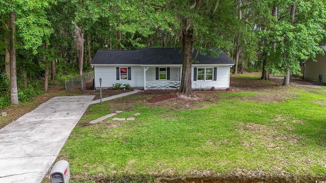 203 Deer Trce, Myrtle Beach, SC 29588 - single story home with a porch, driveway, and a front lawn