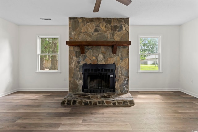 203 Deer Trce, Myrtle Beach, SC 29588 - detailed view of wood finished floors, a ceiling fan, a fireplace, and baseboards