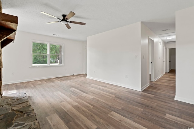 203 Deer Trce, Myrtle Beach, SC 29588 - unfurnished living room featuring wood finished floors, ceiling fan, and baseboards