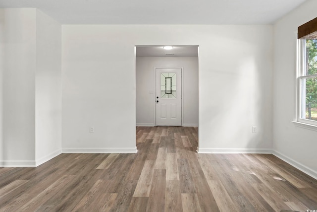203 Deer Trce, Myrtle Beach, SC 29588 - empty room featuring plenty of natural light, wood finished floors, and baseboards