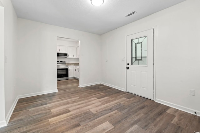 203 Deer Trce, Myrtle Beach, SC 29588 - spare room featuring dark wood-style flooring and baseboards