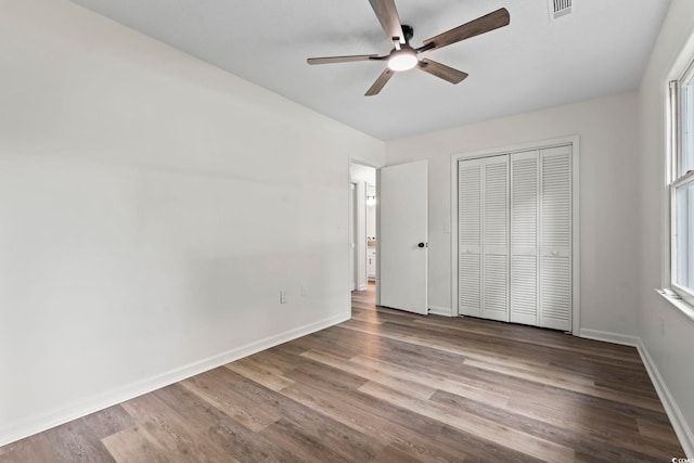 203 Deer Trce, Myrtle Beach, SC 29588 - unfurnished bedroom featuring wood finished floors, baseboards, a closet, and ceiling fan