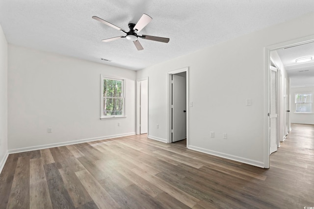 203 Deer Trce, Myrtle Beach, SC 29588 - unfurnished bedroom featuring wood finished floors, a textured ceiling, baseboards, and ceiling fan