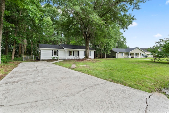 203 Deer Trce, Myrtle Beach, SC 29588 - ranch-style house with driveway, a front lawn, and covered porch