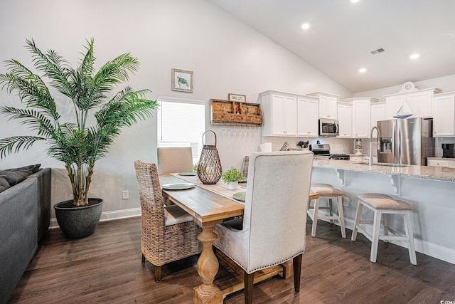 981 Mourning Dove Dr, Myrtle Beach, SC 29577 - dining space with dark wood finished floors, high vaulted ceiling, recessed lighting, and baseboards