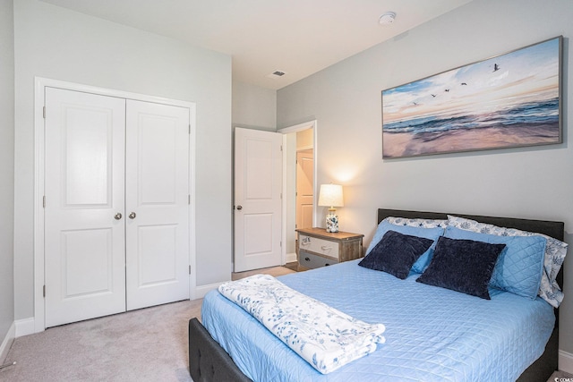 981 Mourning Dove Dr, Myrtle Beach, SC 29577 - bedroom with light carpet, a closet, and baseboards