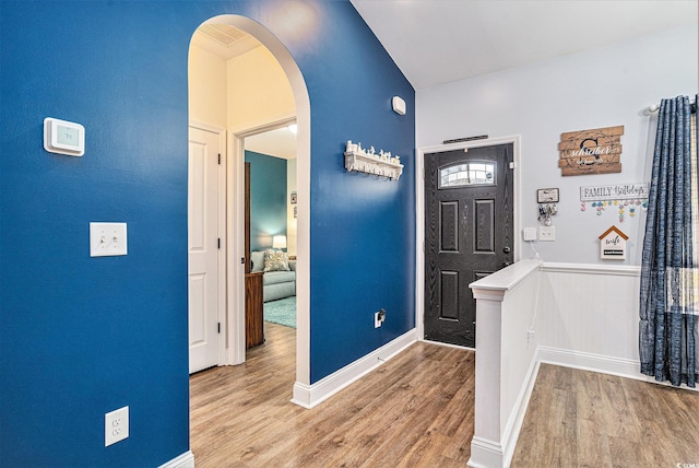 1904 Ronald Phillips Ave, Conway, SC 29527 - foyer entrance featuring arched walkways, wood finished floors, and baseboards