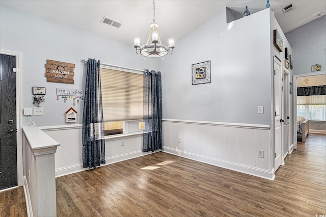 1904 Ronald Phillips Ave, Conway, SC 29527 - unfurnished dining area featuring wood finished floors, a chandelier, vaulted ceiling, wainscoting, and baseboards