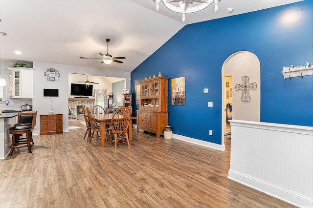 1904 Ronald Phillips Ave, Conway, SC 29527 - dining room featuring a ceiling fan, light wood-style flooring, arched walkways, vaulted ceiling, and baseboards