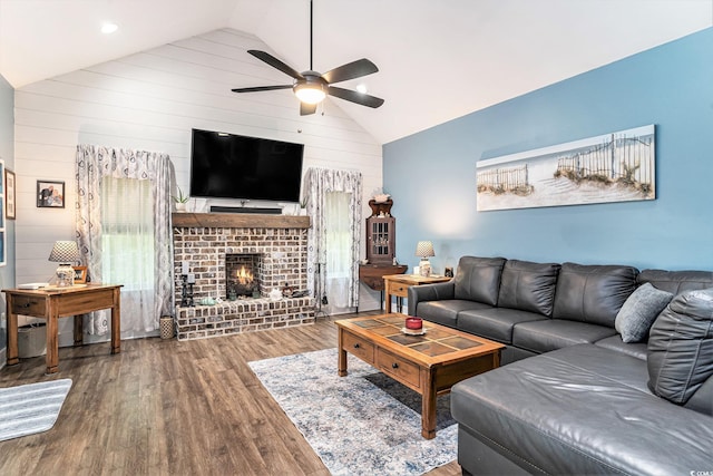 1904 Ronald Phillips Ave, Conway, SC 29527 - living area featuring ceiling fan, wood finished floors, wood walls, a fireplace, and high vaulted ceiling