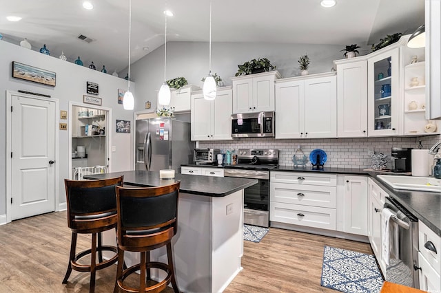 1904 Ronald Phillips Ave, Conway, SC 29527 - kitchen featuring stainless steel appliances, dark countertops, a sink, tasteful backsplash, and high vaulted ceiling