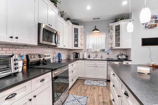 1904 Ronald Phillips Ave, Conway, SC 29527 - kitchen featuring appliances with stainless steel finishes, a sink, dark countertops, and recessed lighting