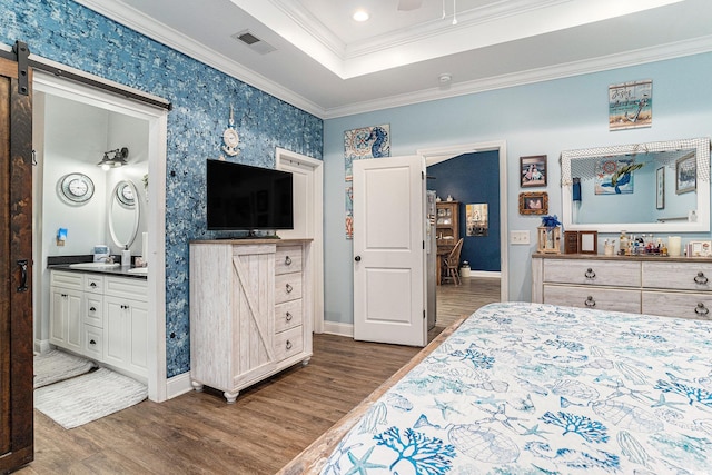 1904 Ronald Phillips Ave, Conway, SC 29527 - bedroom with dark wood-style floors, crown molding, baseboards, a raised ceiling, and a barn door