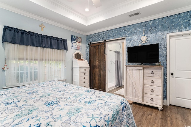 1904 Ronald Phillips Ave, Conway, SC 29527 - bedroom with wood finished floors, a barn door, ornamental molding, a tray ceiling, and wallpapered walls