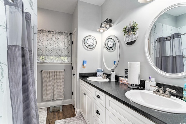 1904 Ronald Phillips Ave, Conway, SC 29527 - bathroom featuring double vanity, wood finished floors, and a shower with shower curtain