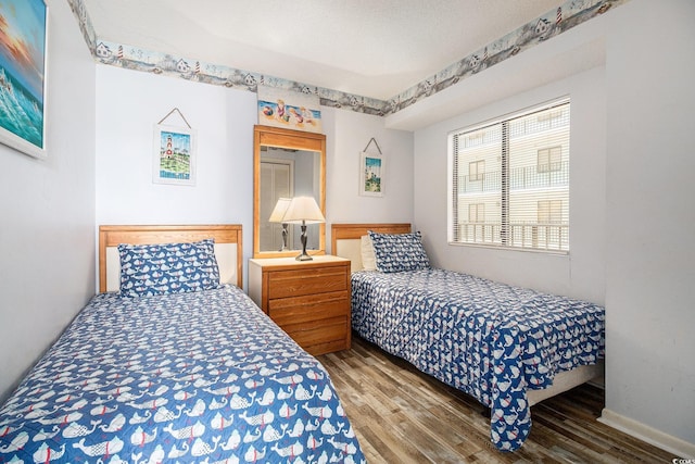 1425 S Ocean Blvd Unit 2A, North Myrtle Beach, SC 29582 - bedroom featuring wood finished floors and baseboards