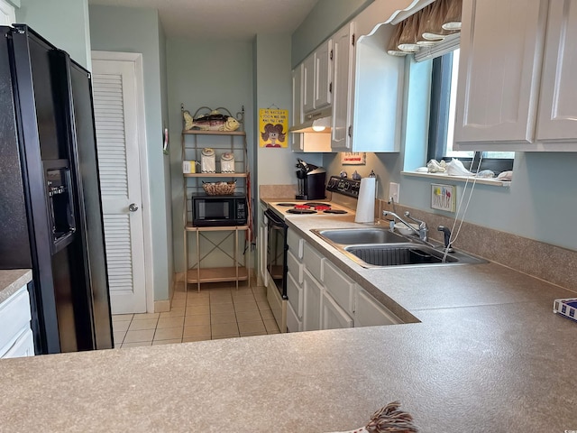 2101 S Ocean Blvd Unit A-4, North Myrtle Beach, SC 29582 - kitchen featuring black appliances, under cabinet range hood, a sink, light tile patterned flooring, and white cabinets