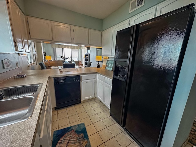 2101 S Ocean Blvd Unit A-4, North Myrtle Beach, SC 29582 - kitchen featuring black appliances, a sink, light tile patterned floors, white cabinets, and light countertops