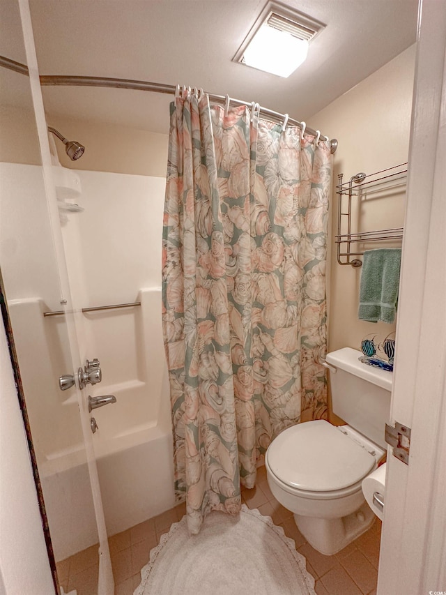 2101 S Ocean Blvd Unit A-4, North Myrtle Beach, SC 29582 - bathroom featuring shower / bath combo, tile patterned flooring, and toilet
