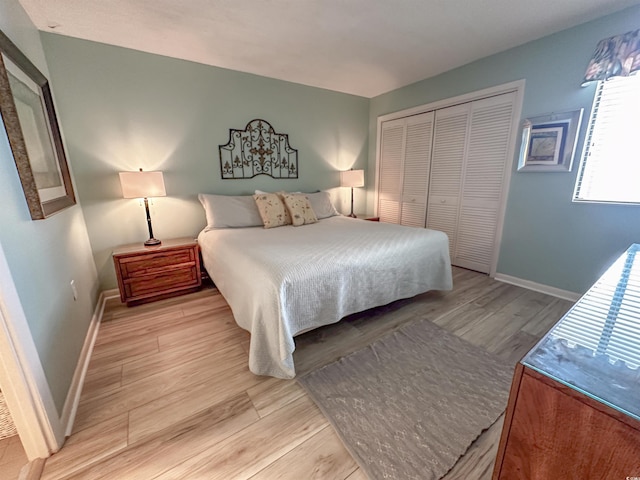2101 S Ocean Blvd Unit A-4, North Myrtle Beach, SC 29582 - bedroom with light wood-style floors, baseboards, and a closet