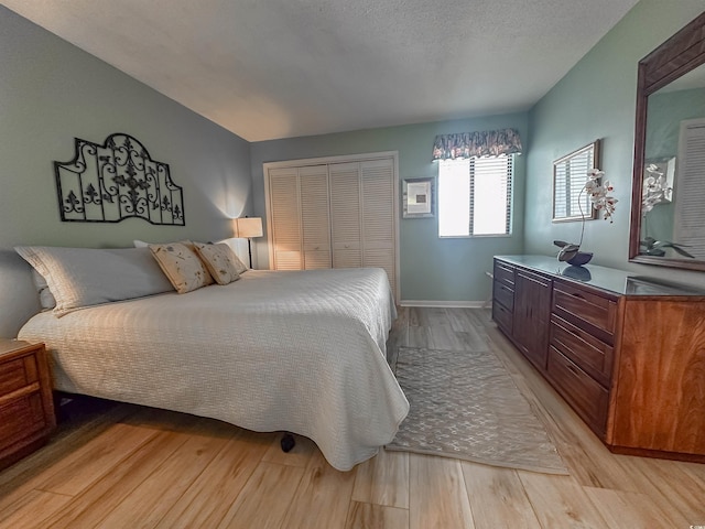 2101 S Ocean Blvd Unit A-4, North Myrtle Beach, SC 29582 - bedroom featuring light wood-type flooring, baseboards, and a closet