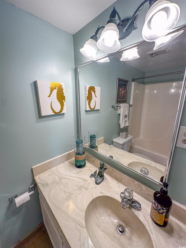 2101 S Ocean Blvd Unit A-4, North Myrtle Beach, SC 29582 - full bathroom featuring vanity, shower / bath combination, toilet, and baseboards