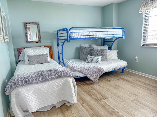 2101 S Ocean Blvd Unit A-4, North Myrtle Beach, SC 29582 - bedroom featuring wood finished floors and baseboards