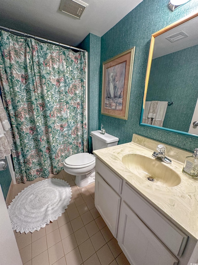 2101 S Ocean Blvd Unit A-4, North Myrtle Beach, SC 29582 - full bathroom featuring vanity, toilet, tile patterned flooring, a shower with curtain, and a textured wall