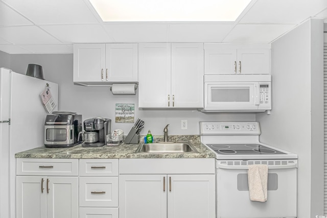 2000 N Ocean Blvd Unit Ph 15, Myrtle Beach, SC 29577 - kitchen featuring white appliances, a paneled ceiling, a sink, and white cabinets