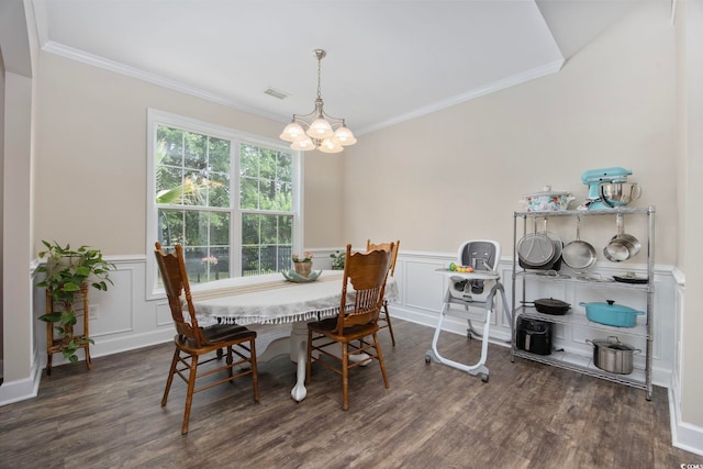 5149 Morning Frost Pl, Myrtle Beach, SC 29579 - dining room featuring a chandelier, ornamental molding, wood finished floors, a wainscoted wall, and a decorative wall
